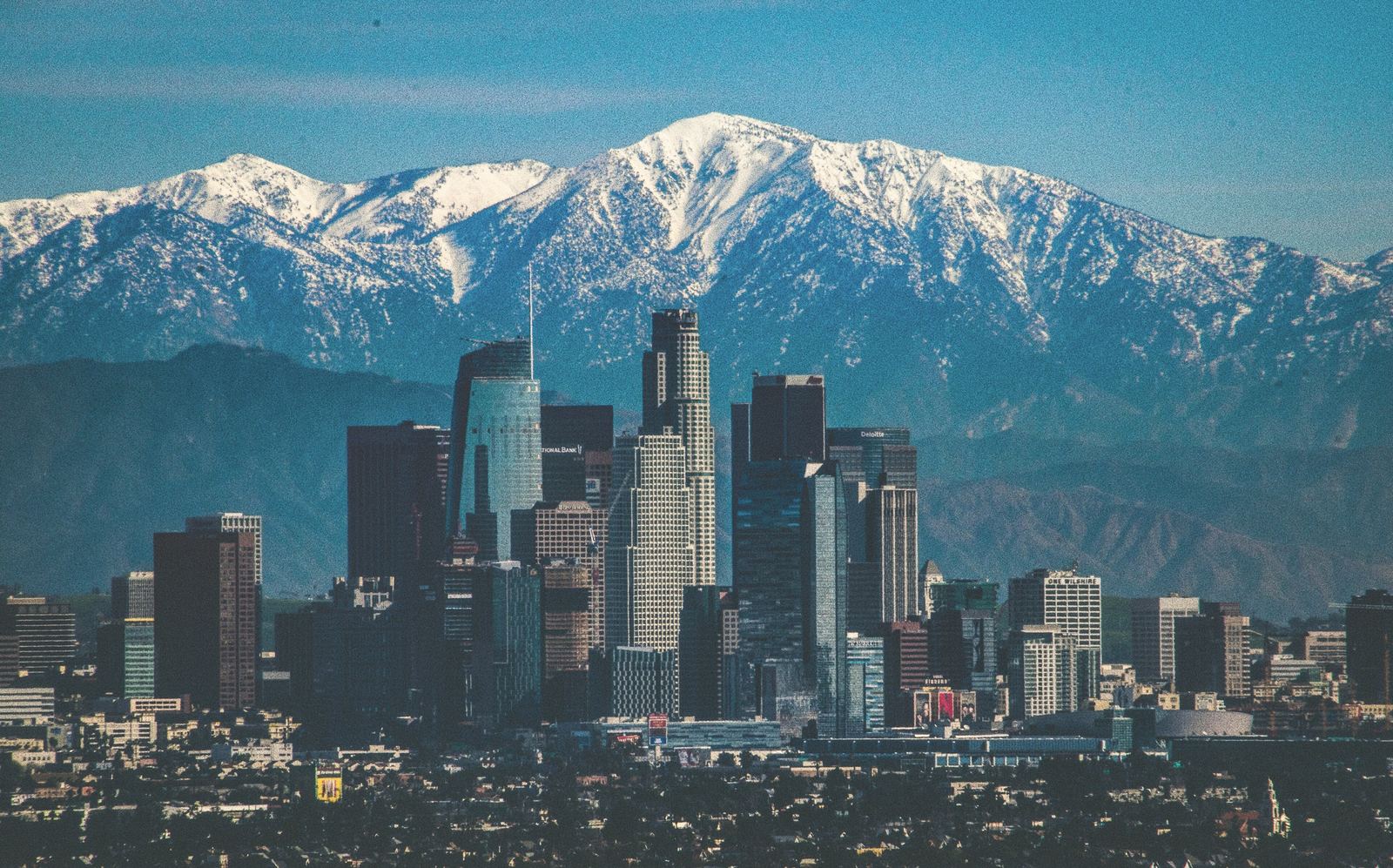 Downtown Los Angeles skyline in front of the snow-capped San Gabriel Mountains